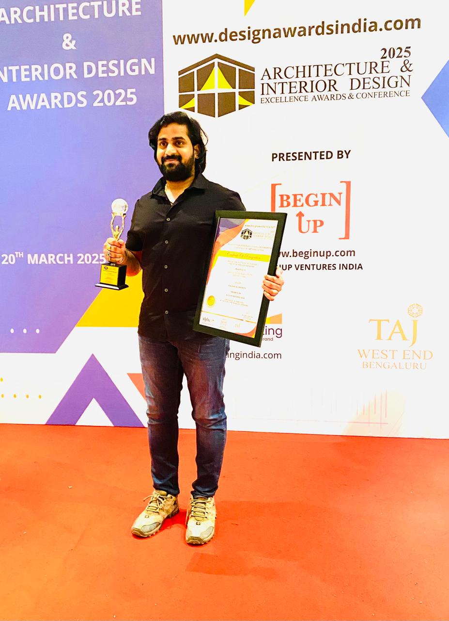 Mr. Santosh Kumar receiving Best Designer Award with trophy and certificate